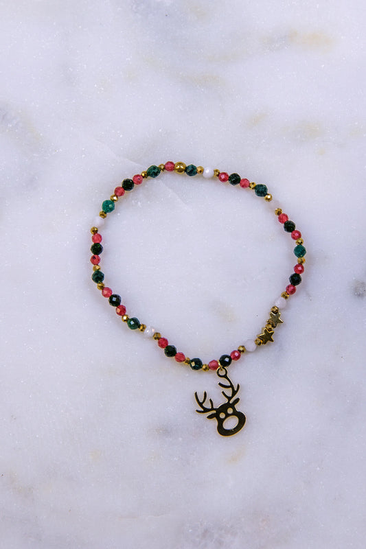 Widok z góry (flat lay) na artystyczną kompozycję biżuterii. Harmonijne połączenie kamieni w barwach ziemi i serca: jadeitu, chalcedonu i Szmaragdu Nilu.